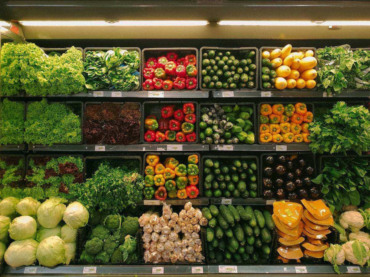 Fresh groceries and vegetables in a shopping cart at the supermarket
